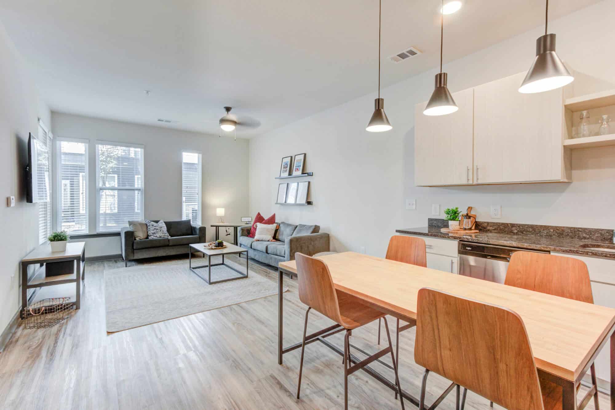 the row at the stadium luxury off campus apartments fully furnished living room and dining area